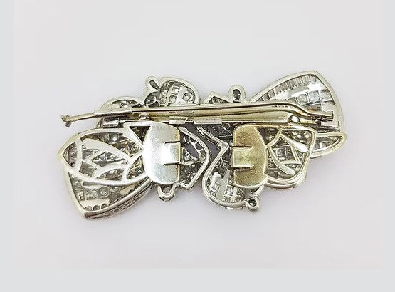 Vintage 10.00ct Diamond Double Clip Bow Brooch; set with baguette and brilliant-cut diamonds, in 18ct white gold.