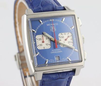 Vintage Tag Heuer Monaco Re Edition Automatic Chronograph with Blue Dial; Steve McQueen, 38mm stainless steel case with blue dial and acrylic crystal, on a blue leather strap with Tag Heuer deployment buckle, Circa 1990s