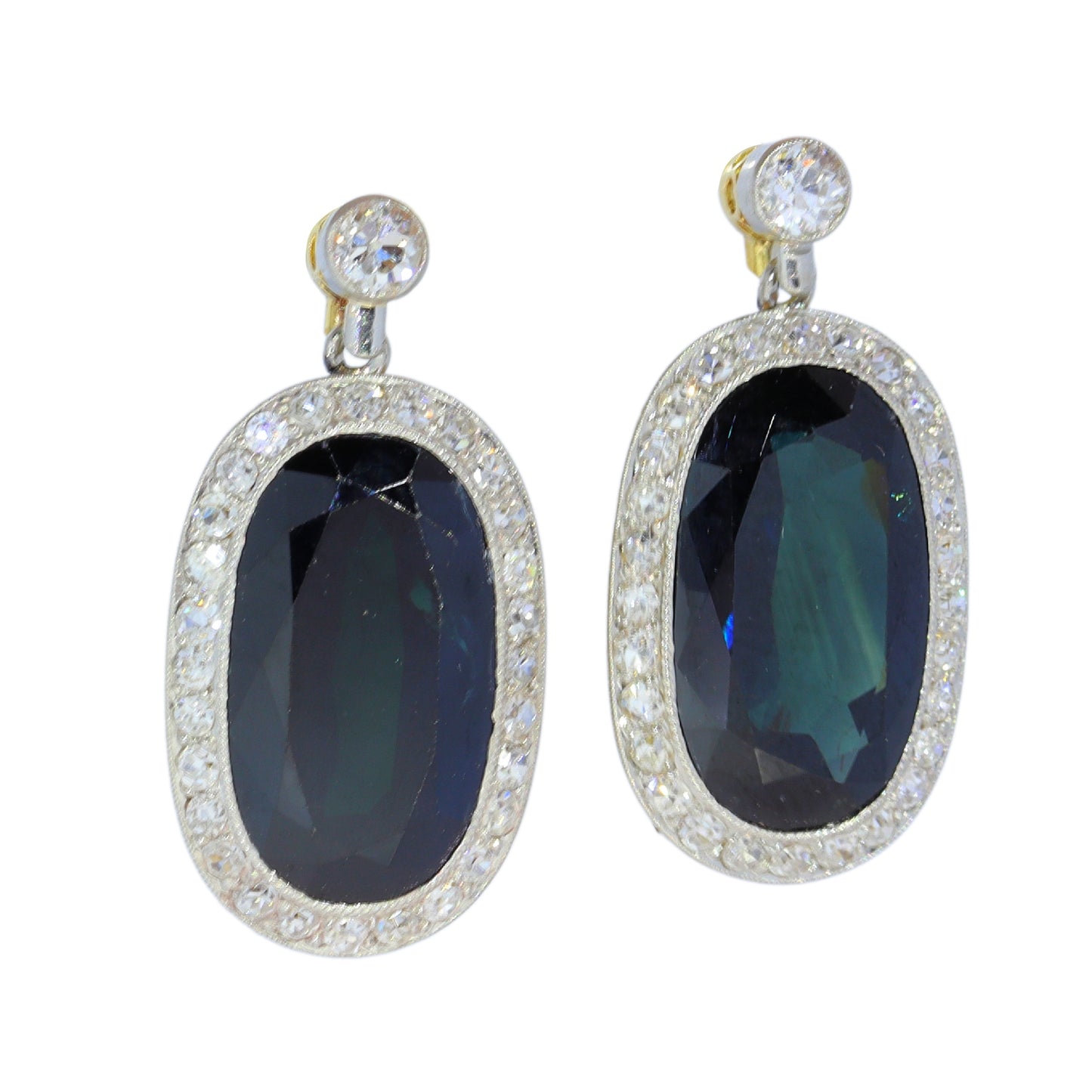 A pair of oval sapphire and diamond cluster drop earrings