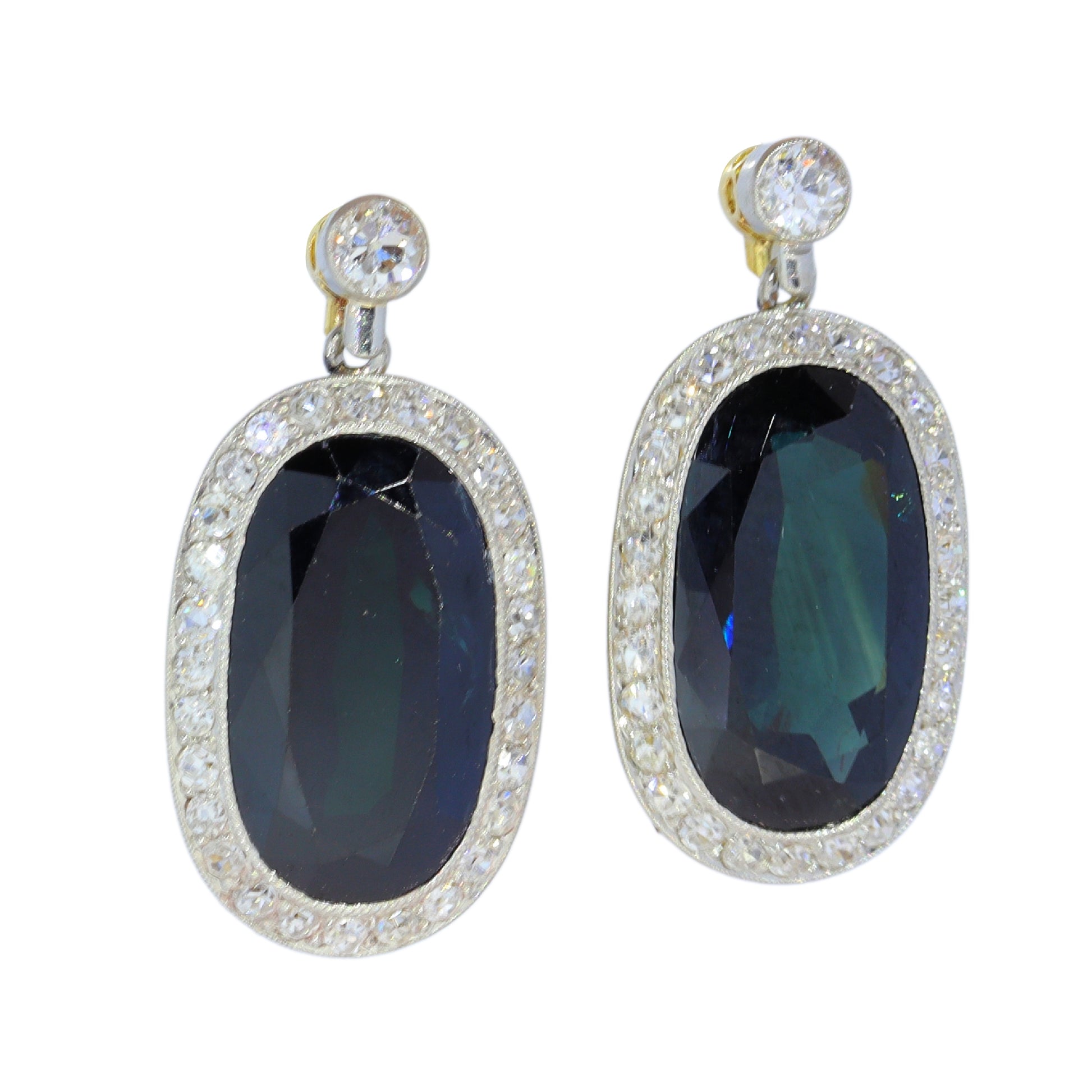 A pair of oval sapphire and diamond cluster drop earrings