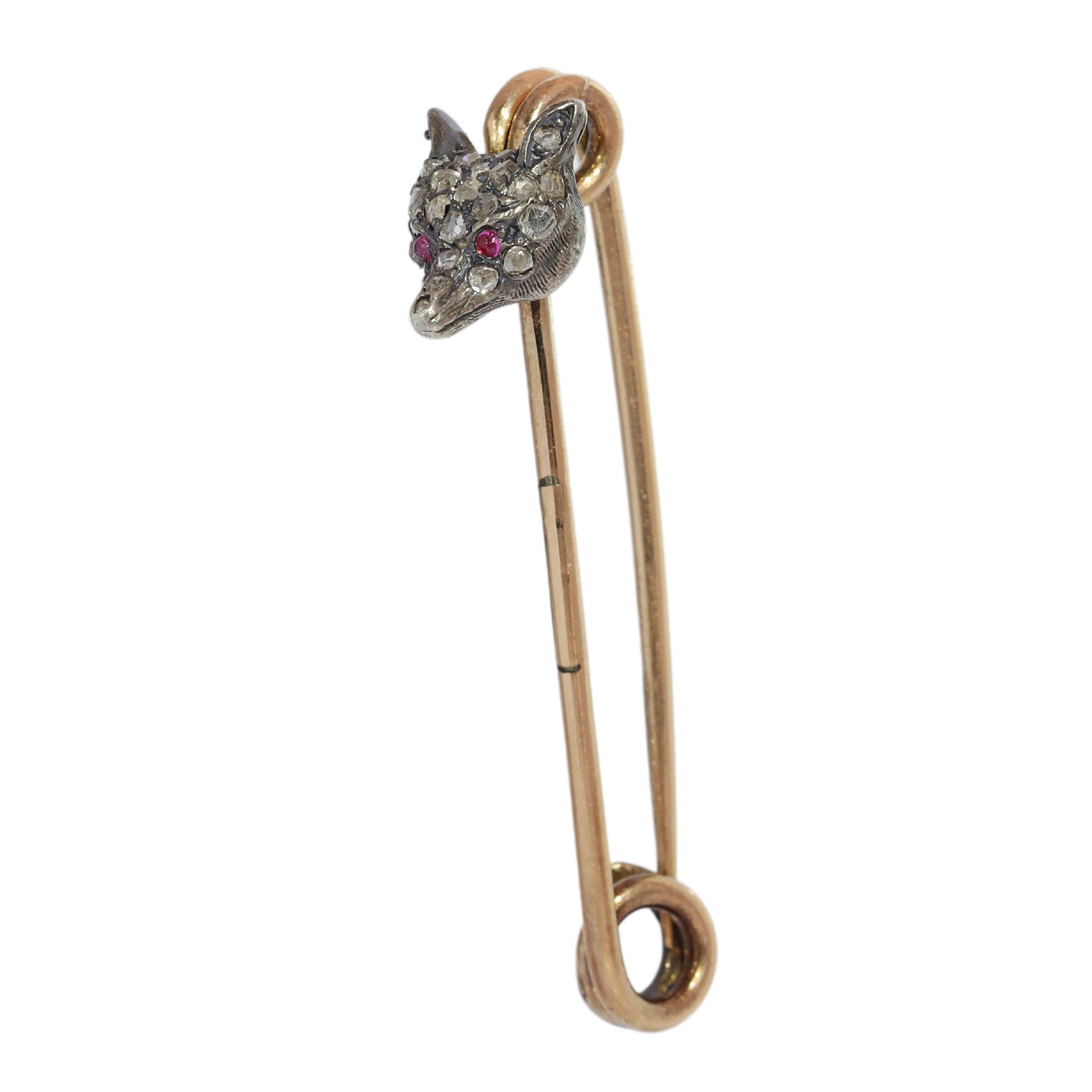 A yellow gold and bar brooch with a silver and diamond set fox head, with red cabochon eyes