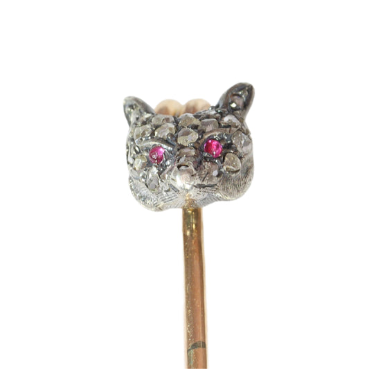A yellow gold and bar brooch with a silver and diamond set fox head, with red cabochon eyes