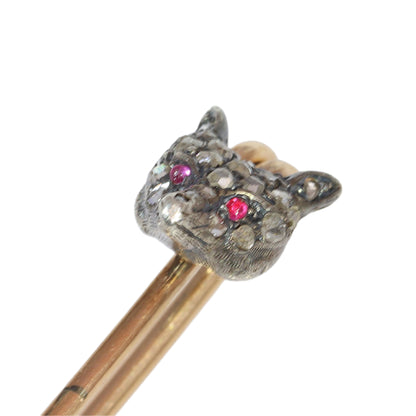 A yellow gold and bar brooch with a silver and diamond set fox head, with red cabochon eyes