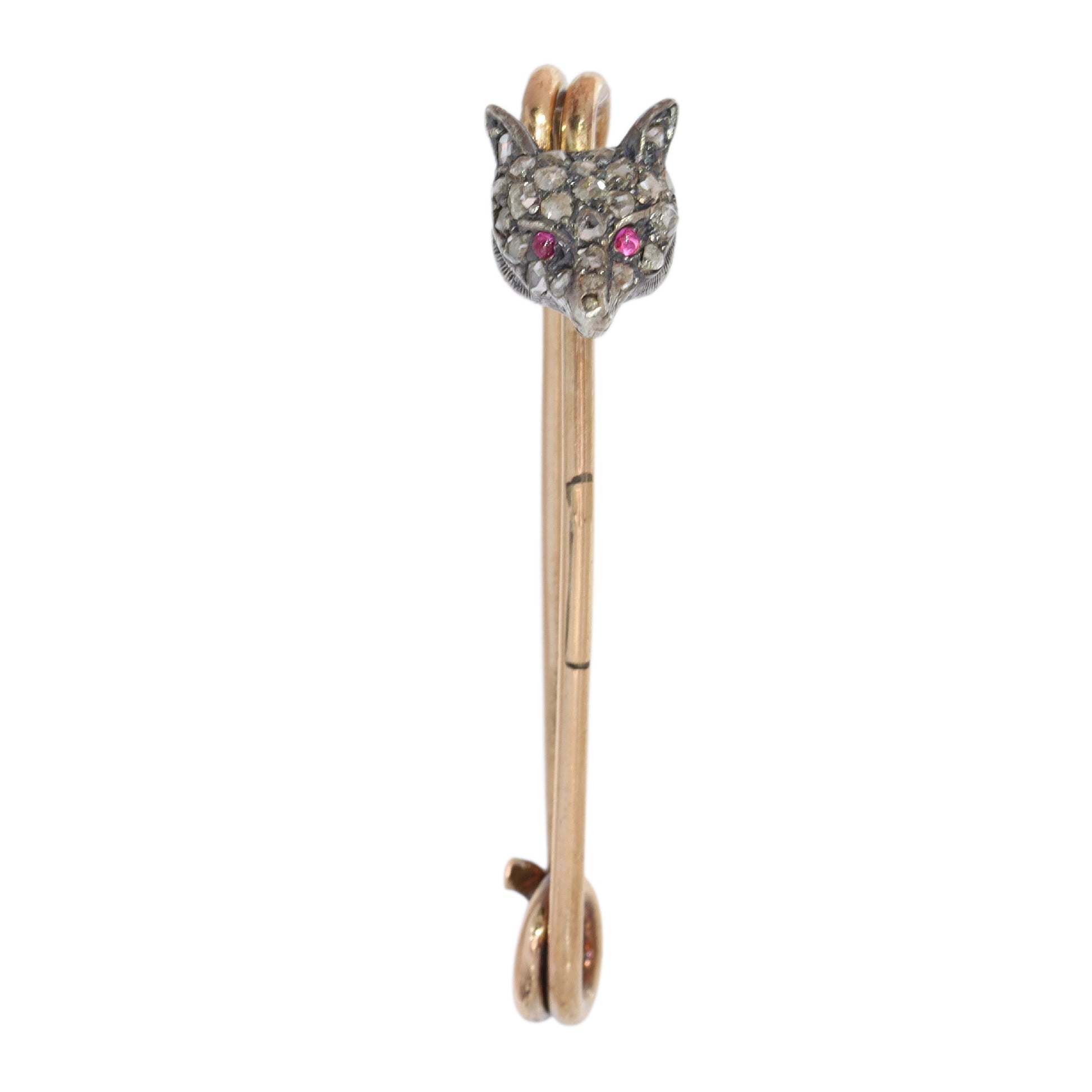 A yellow gold and bar brooch with a silver and diamond set fox head, with red cabochon eyes