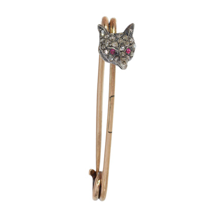 A yellow gold and bar brooch with a silver and diamond set fox head, with red cabochon eyes