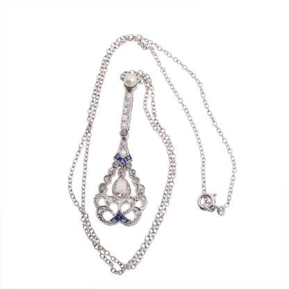 A diamond, sapphire and pearl drop pendant necklace in platinum
