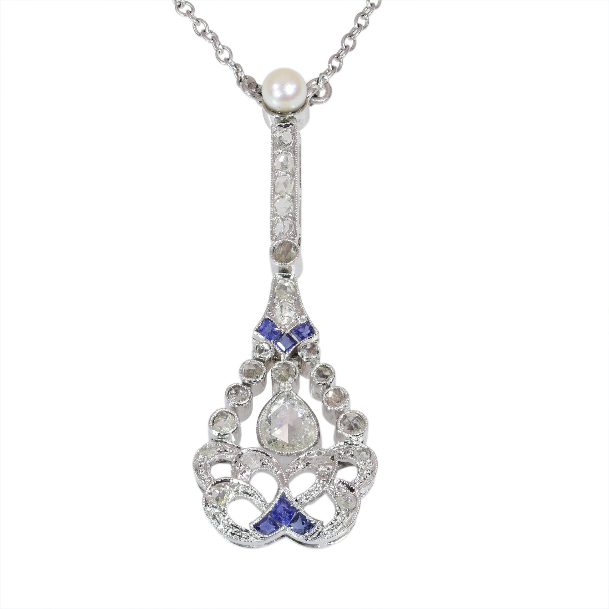 A diamond, sapphire and pearl drop pendant necklace in platinum