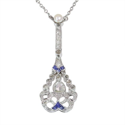 A diamond, sapphire and pearl drop pendant necklace in platinum