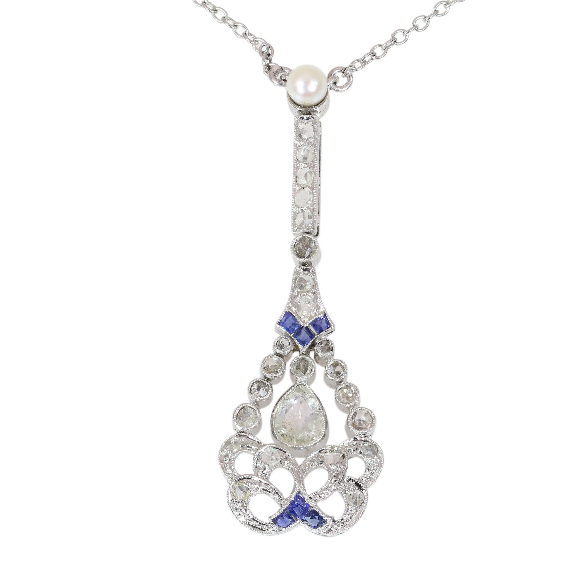 A diamond, sapphire and pearl drop pendant necklace in platinum
