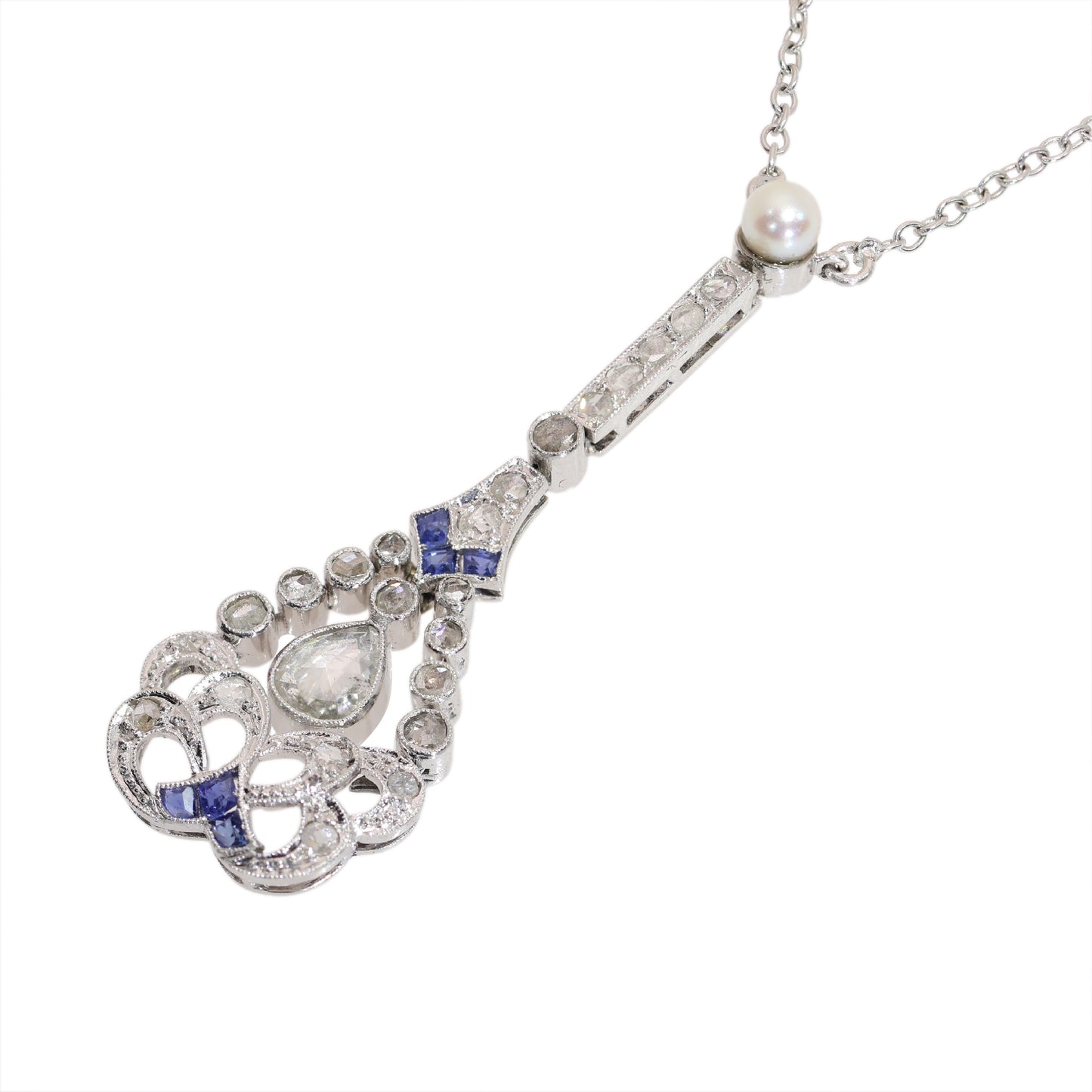 A diamond, sapphire and pearl drop pendant necklace in platinum