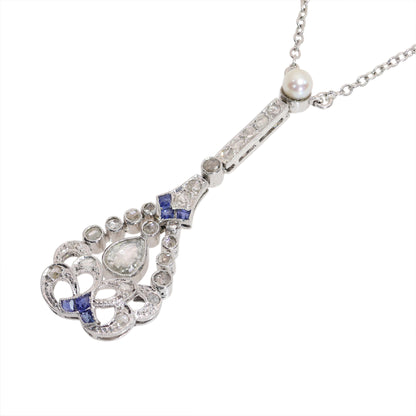 A diamond, sapphire and pearl drop pendant necklace in platinum