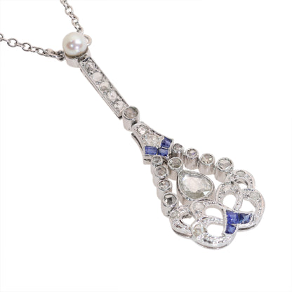 A diamond, sapphire and pearl drop pendant necklace in platinum
