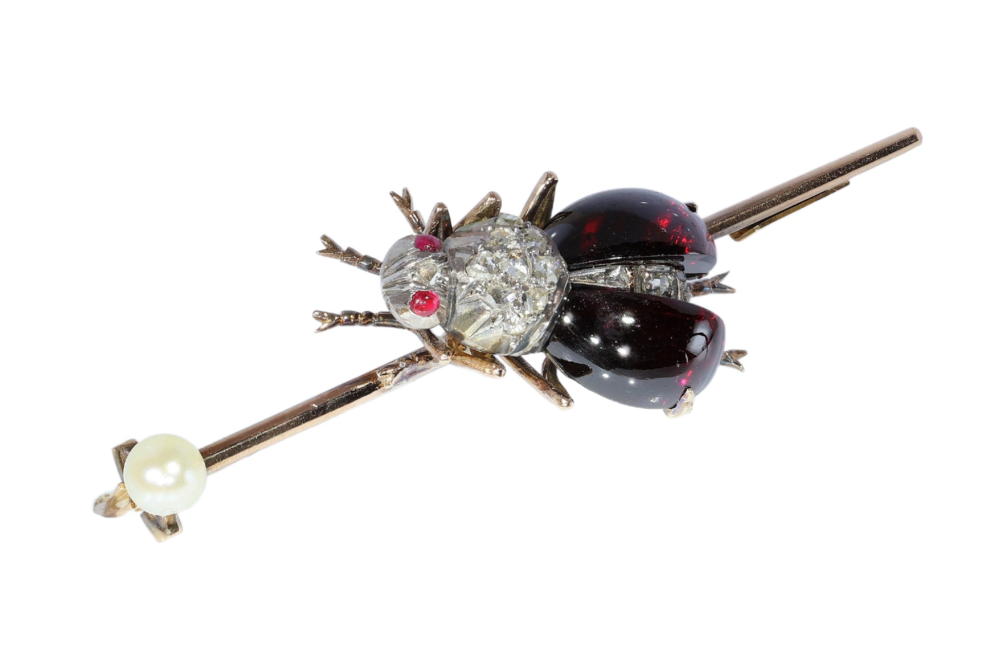 An antique gold bar brooch with a diamond, garnet and ruby set insect in the centre