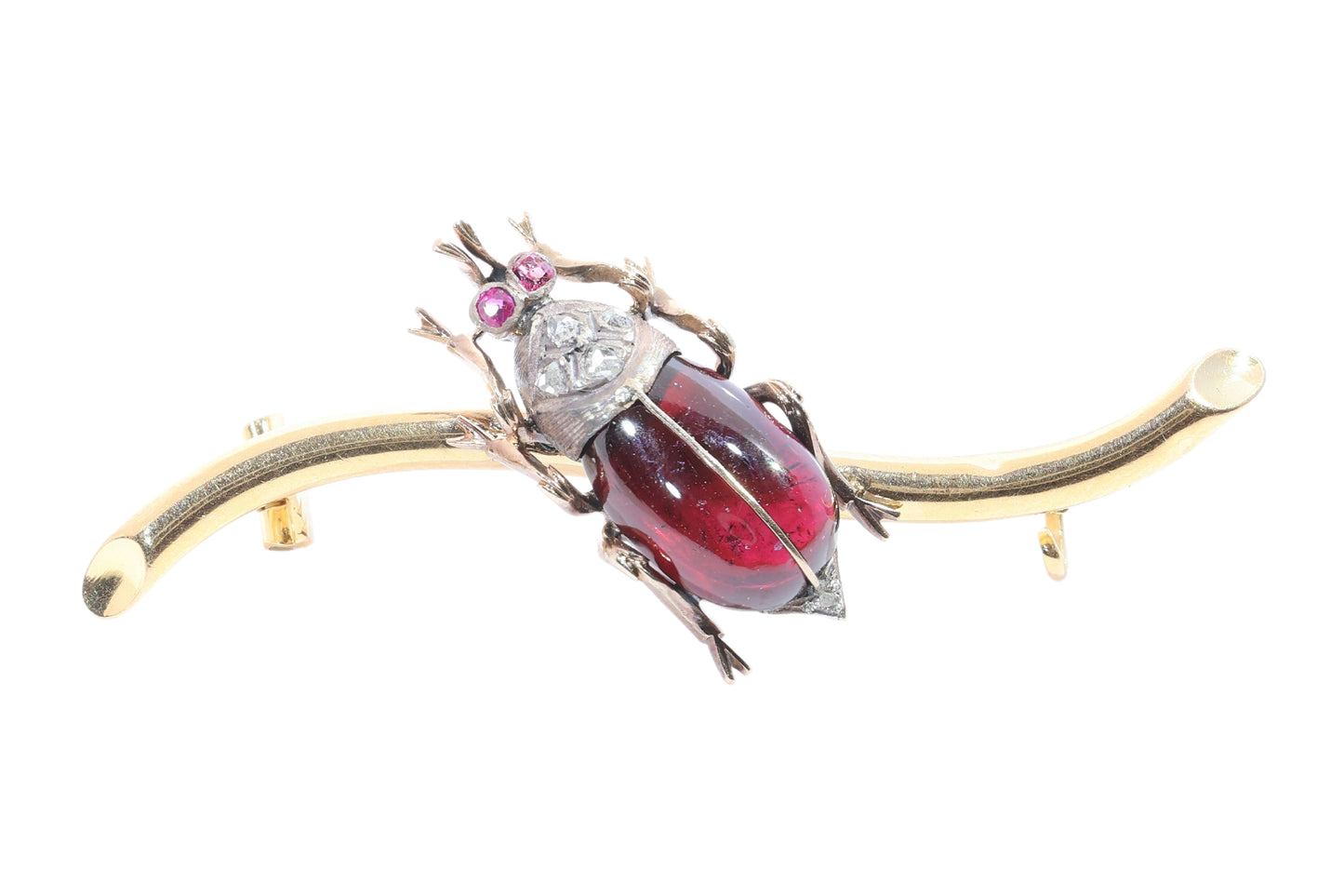 A garnet, ruby and diamond beetle brooch in gold and silver