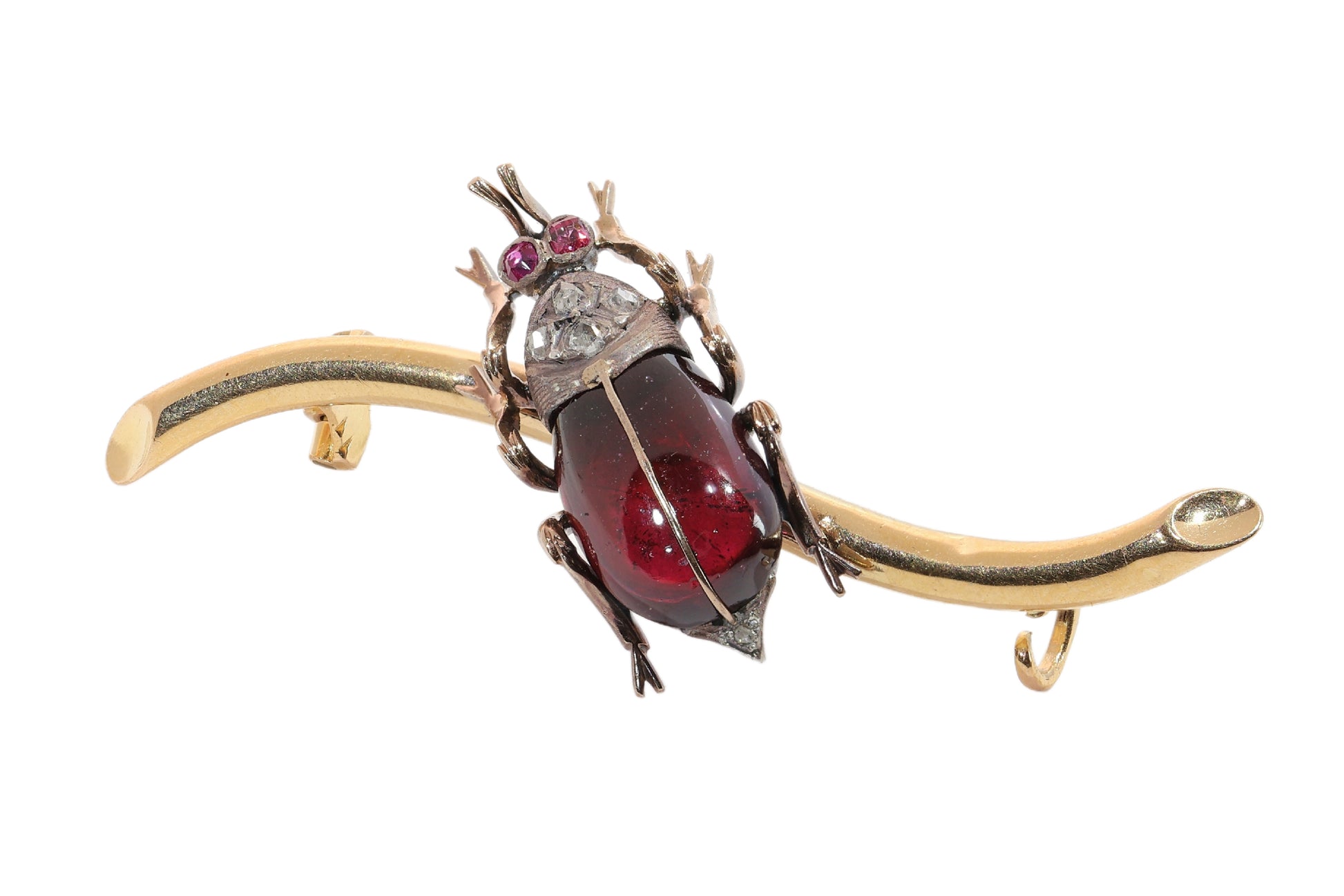 A garnet, ruby and diamond beetle brooch in gold and silver