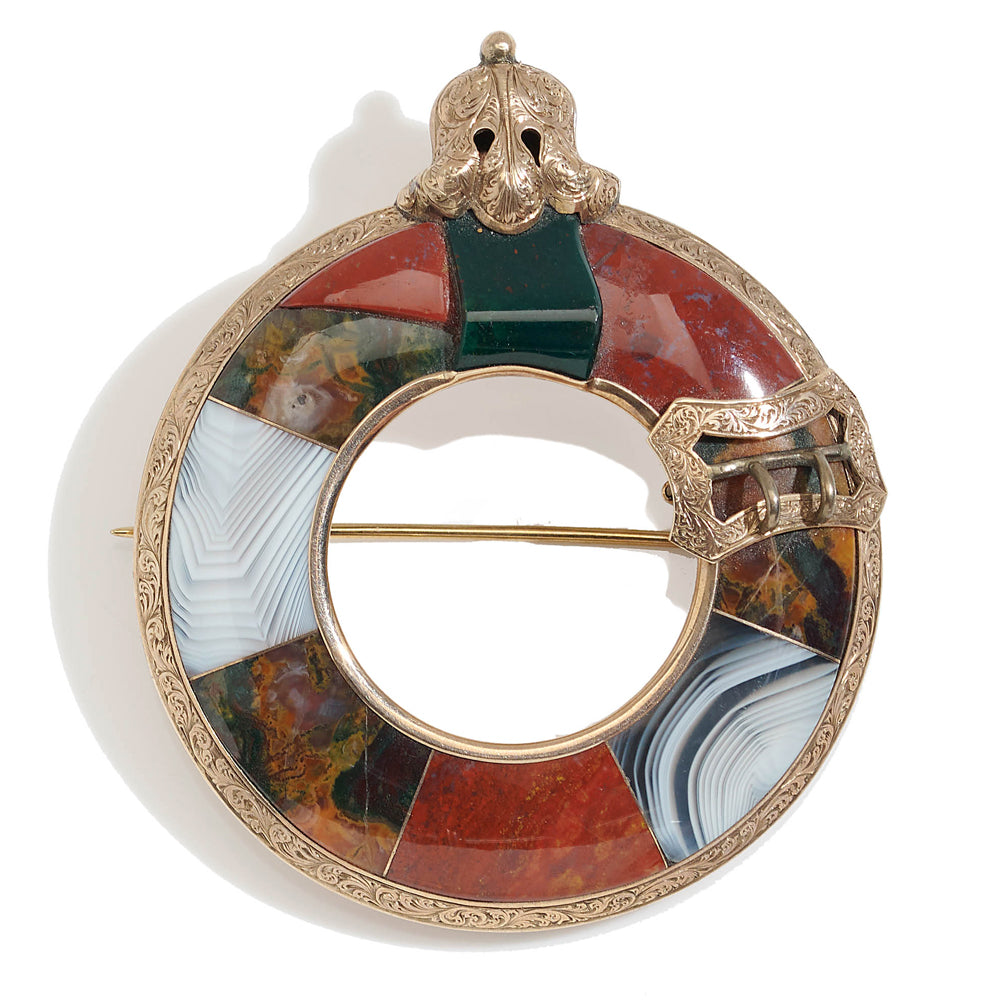 Victorian gold brooch with eight curved panels agates.