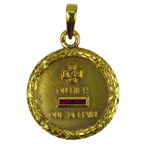 Augis French Plus Hier Ruby, Diamond and 18ct Gold Love Charm Pendant; Plus qu'hier, moins que demain, set with five single cut white diamonds and three rectangular synthetic rubies