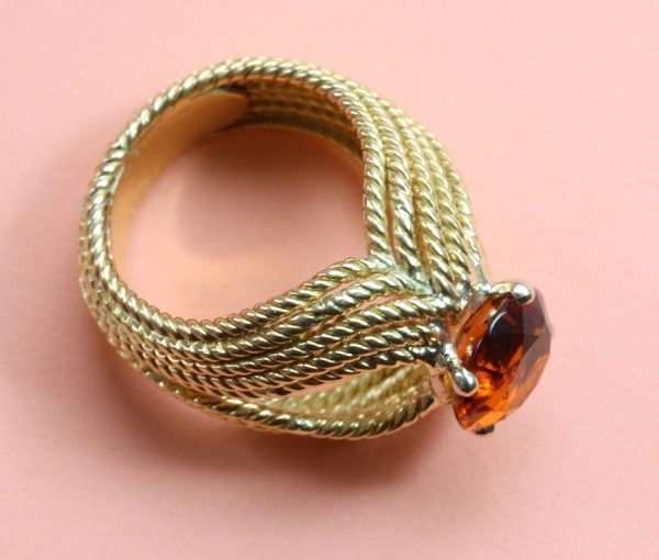 Boucheron Vintage Orange Garnet and 18ct Yellow Gold Cocktail Ring; 18ct gold rope twist ring set with 2ct brilliant cut orange garnet. Signed and numbered