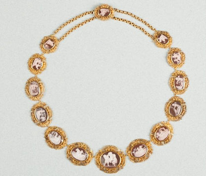 Antique Georgian Amor Cameo and 15ct Gold Necklace; set with fourteen sardonyx cameos with genre scenes of Amor, the God of Love, Circa 1820-1830.