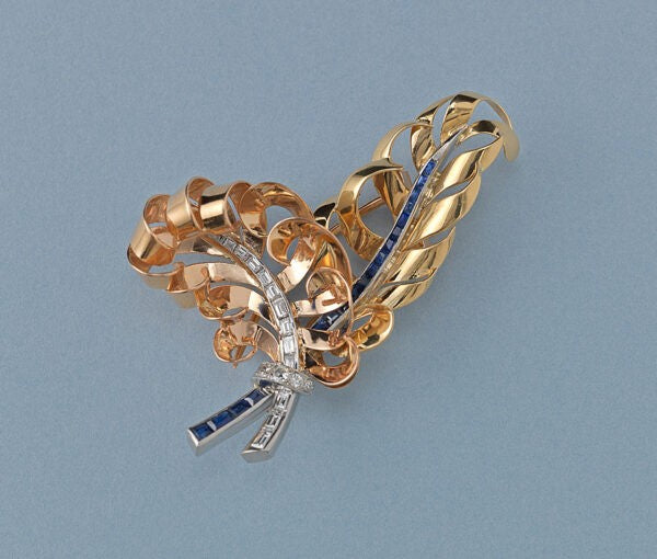 Vintage French Retro 18ct Gold, Diamond and Sapphire Feather Brooch; 18ct rosé and yellow gold feathers set with calibré diamonds and sapphires, with diamond set platinum ribbon.