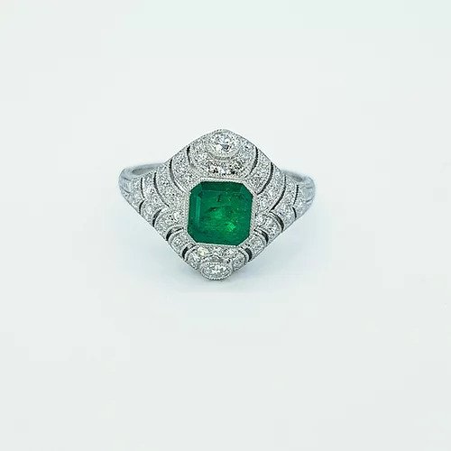 Art Deco Style Colombian Emerald and Diamond Domed Cocktail Ring; octagonal cut emerald surrounded by diamonds in a pierced domed mount, in platinum