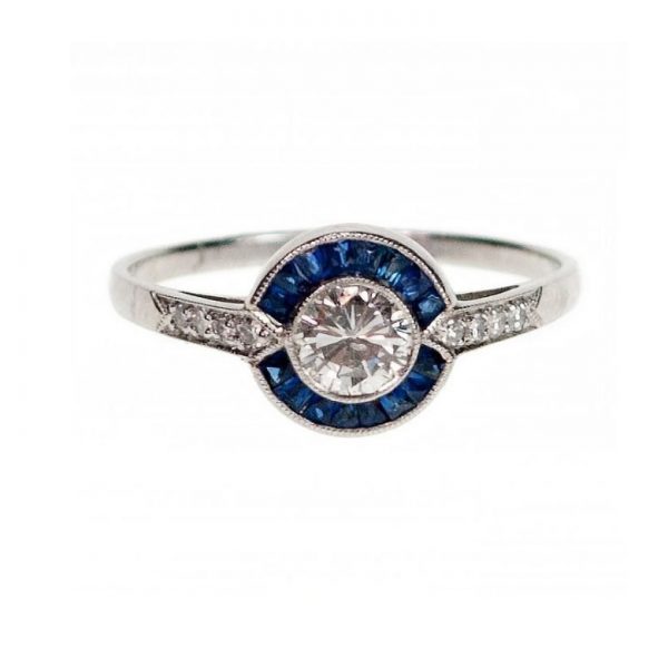 Vintage Art Deco Style Sapphire, Diamond and Platinum Target Cluster Ring; 0.40ct round brilliant-cut diamond surrounded by 0.60cts calibre-cut sapphires