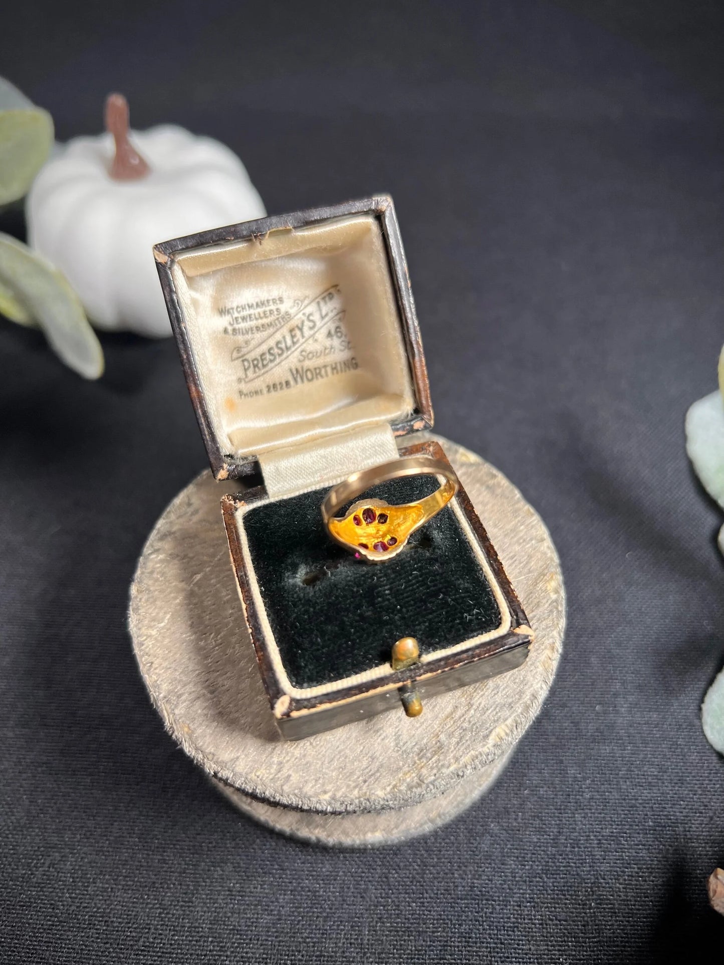 A yellow gold ruby and pearl cluster ring, in a ring box