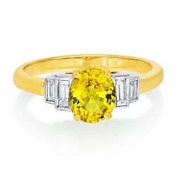 2.41ct Yellow Sapphire Engagement Ring with Baguette Diamonds, 2.41ct oval yellow sapphire flanked by stepped baguette-cut diamond shoulders in 18ct yellow gold