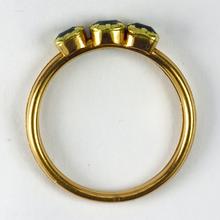 Antique Emerald Gimmel Fede Trinity Ring; comprising of three hinged parts, each set with a collet set step cut green emerald, come together to form a trinity set when the ring is closed, 18ct yellow gold, Circa 1809-1819