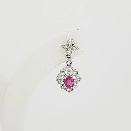 Edwardian Style Ruby and Diamond Cluster Drop Earrings; oval faceted rubies within diamond set openwork cluster surround, suspended from a diamond set fleur-de-lis stud. Mounted in 18ct white gold.