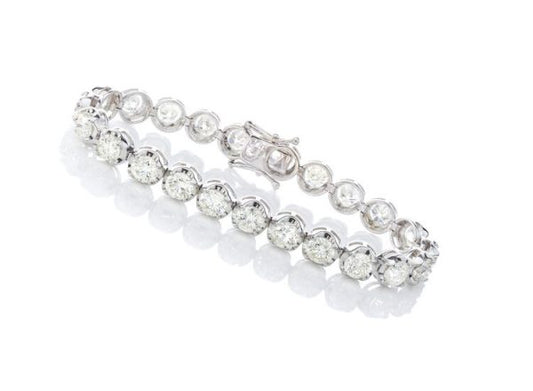 Vintage Diamond Tennis Bracelet, set with 23 round brilliant-cut diamonds, 23.00 carat total, mounted in 18ct white gold. Circa 1970's