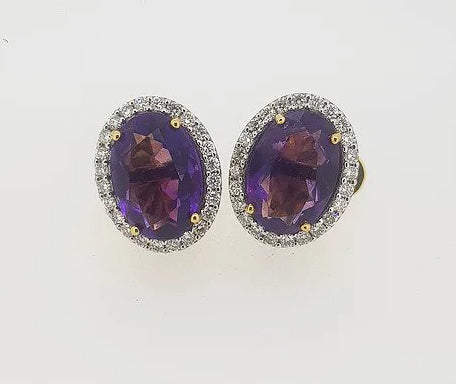 Amethyst and Diamond Oval Cluster Studs Earrings; 8.00cts oval faceted amethysts surrounded by 0.87cts diamonds, mounted in 18ct yellow gold.
