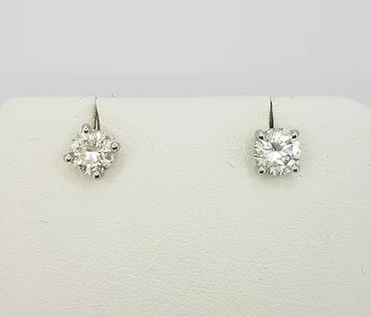 Pair of Diamond Stud Earrings; brilliant-cut diamonds, 0.97 carat total, four-claw set, in 18ct white gold. Diamond colour 'H', clarity 'SI1' 
