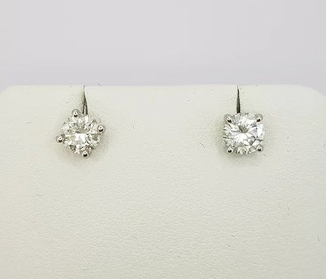 Pair of Diamond Stud Earrings; brilliant-cut diamonds, 0.97 carat total, four-claw set, in 18ct white gold. Diamond colour 'H', clarity 'SI1' 