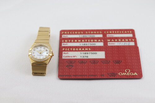 Omega Constellation Double Eagle 18ct Yellow Gold Ladies 25mm Quartz Watch, 11897500, diamond bezel and hour markers, white mother of pearl dial, 18ct Yellow Gold bracelet with a double-fold hidden clasp, with original Omega box and papers.