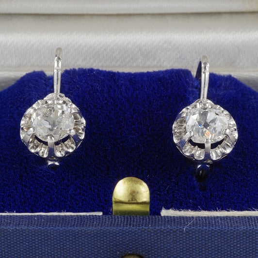 Art Deco 1.60ct Old Mine Cut Diamond Solitaire Drop Earrings, single stone old mine-cut diamonds within filigree borders crafted in 18ct white gold. Circa 1930