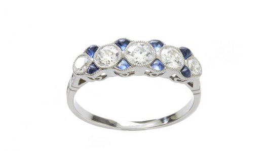 Art Deco Old Cut Diamond, Sapphire and Platinum Five Stone Ring; set with five graduated old-cut diamonds interspersed with 0.24cts cabochon sapphires, diamonds totalling 0.79 carats, Circa 1920s