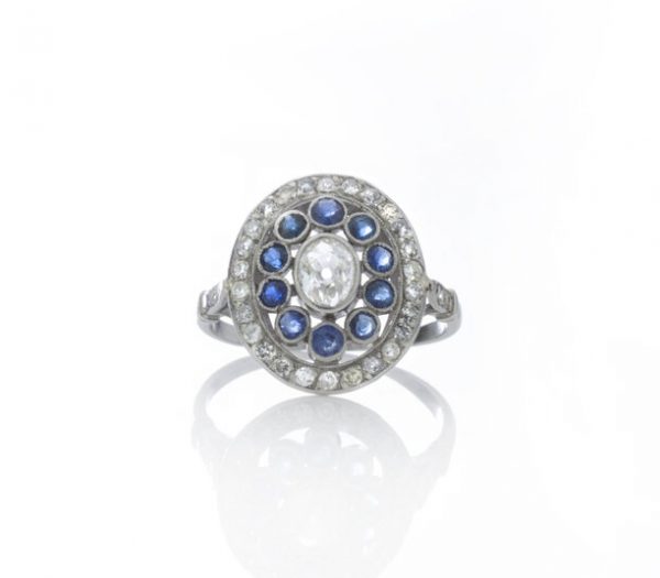 Art Deco Old Cut Diamond and Sapphire Cluster Ring in Platinum; set with 0.66cts old-cut diamonds and 0.40cts blue sapphires. Made in France, Circa 1920