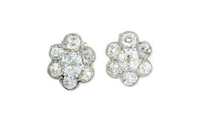 Antique Victorian Old Cut Diamond Floral Cluster Stud Earrings; set with 1.44 carats old cut diamonds arranged in a flower cluster design, in 18ct yellow gold, 19th century, Circa 1860s