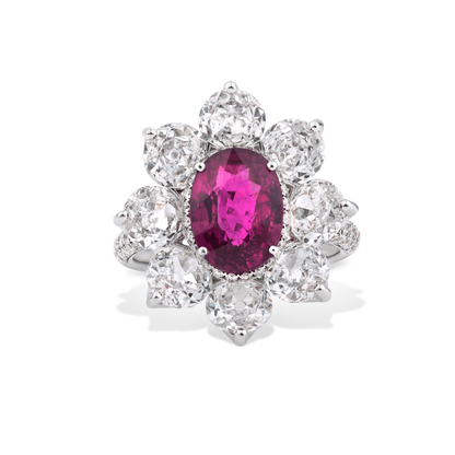Burmese Ruby and Old Cut Diamond Floral Cluster Ring; central 3.69 carat Burmese ruby framed by 8 round old-cut diamonds, accented by 94 pave set diamonds. Total diamond weight 4.46cts
