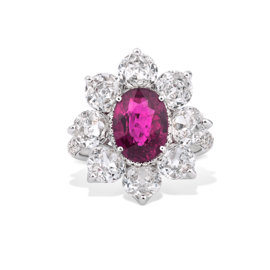 Burmese Ruby and Old Cut Diamond Floral Cluster Ring; central 3.69 carat Burmese ruby framed by 8 round old-cut diamonds, accented by 94 pave set diamonds. Total diamond weight 4.46cts