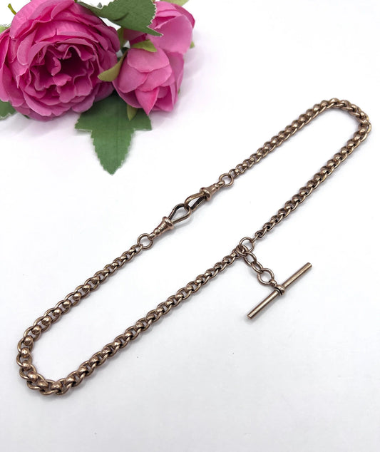 A rose gold fancy link Albert chain necklace with a T-bar attachment