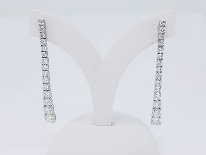 Diamond Set Long Drop Earrings, set with graduated diamonds, 2.40 carat total, claw set, in 18ct white gold. Post and butterfly fittings.