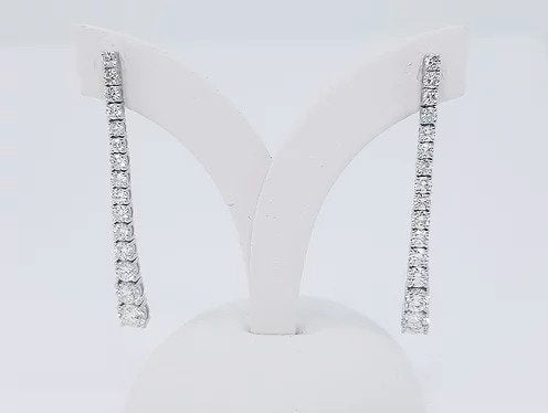 Diamond Set Long Drop Earrings, set with graduated diamonds, 2.40 carat total, claw set, in 18ct white gold. Post and butterfly fittings.