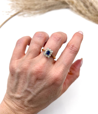 A sapphire and pearl cluster ring in yellow gold and platinum, modelled on a hand
