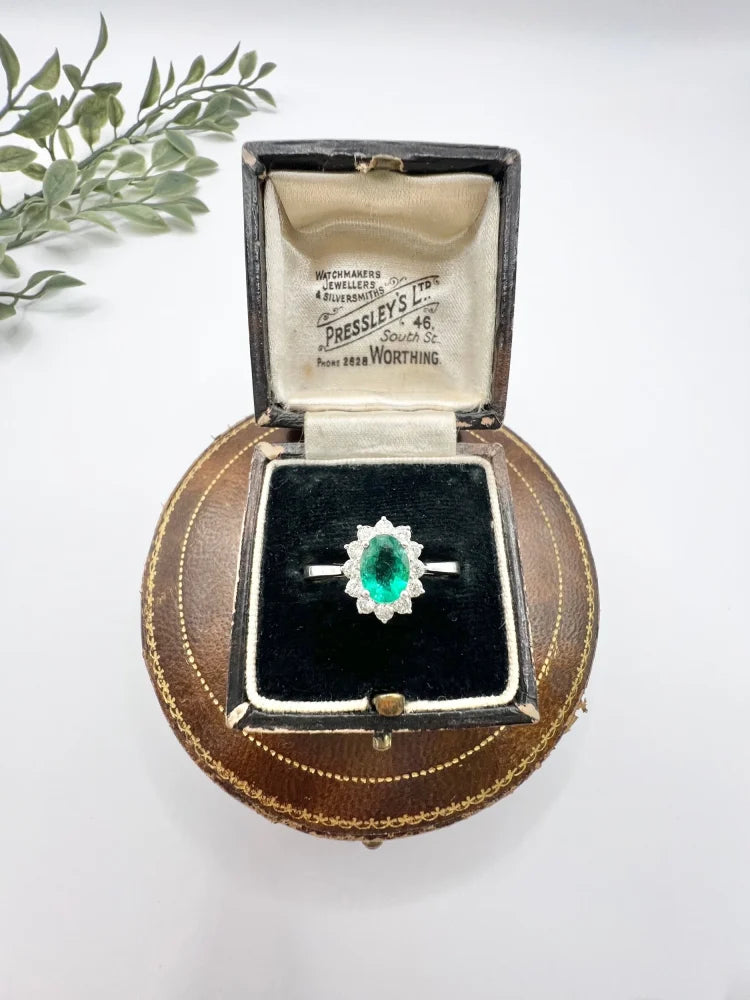 Emerald And Diamond Cluster Ring In 18 Carat White Gold