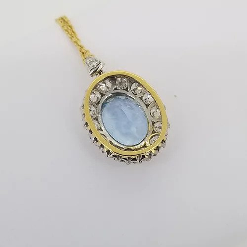 Aquamarine and Diamond Oval Cluster Pendant; large 7 carat oval faceted aquamarine surrounded by 1.84cts brilliant-cut diamonds, in 18ct white and yellow gold