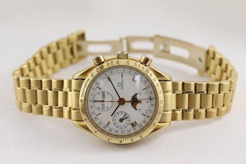 Omega Speedmaster Triple Date Moon Chronograph 18ct Yellow Gold 39mm Watch, white dial, chronograph function, weekday, month, date, moon-phase indicators, sapphire crystal, on an 18ct Yellow Gold bracelet with matching fold-over clasp, with an Omega box.