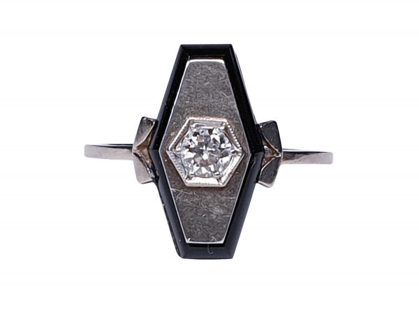 Art Deco French Old Cut Diamond and Onyx Lozenge Plaque Ring; hexagonal ring with central 0.25ct old cut diamond on a matt ground with a fine onyx border. Set in white gold, Circa 1925