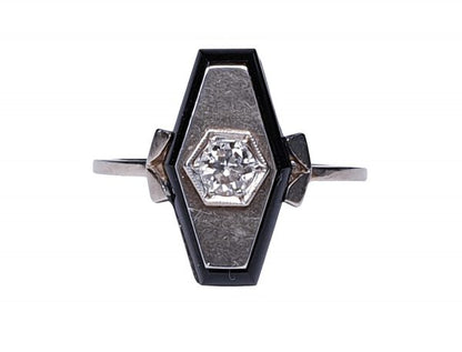 Art Deco French Old Cut Diamond and Onyx Lozenge Plaque Ring; hexagonal ring with central 0.25ct old cut diamond on a matt ground with a fine onyx border. Set in white gold, Circa 1925